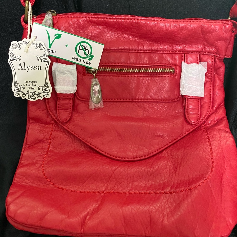 Brand new red soft vegan leather handbag.
